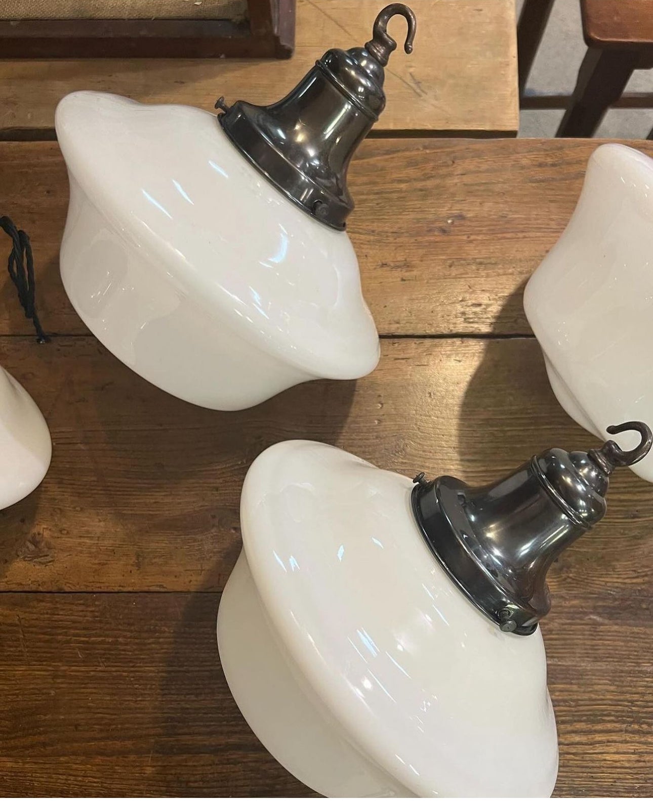 A run of four opaline pendant lights