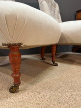 A pair of Napoleon III scroll back slipper chairs