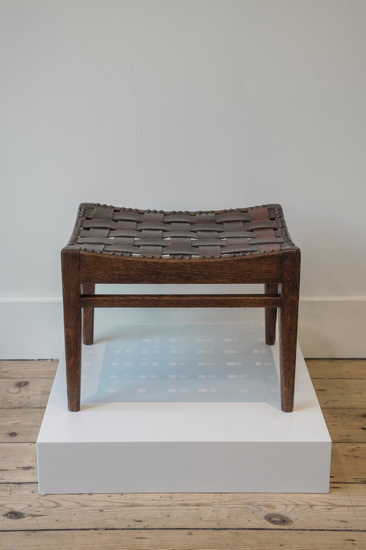 Arthur Simpson, The Handicrafts, Kendall. Woven Leather Footstool.