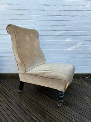 A late 19th century slipper chair