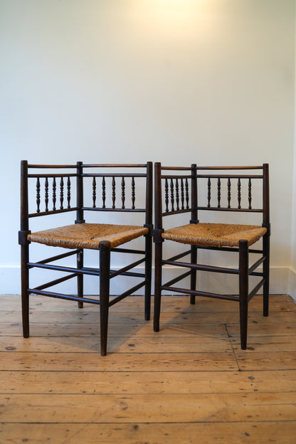 A pair of “Sussex” Corner Chairs.