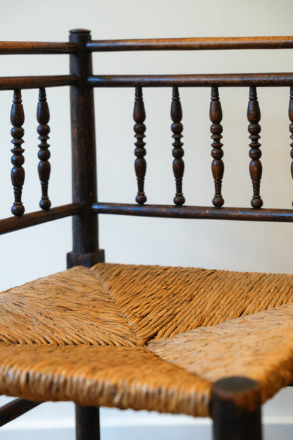 A pair of “Sussex” Corner Chairs.