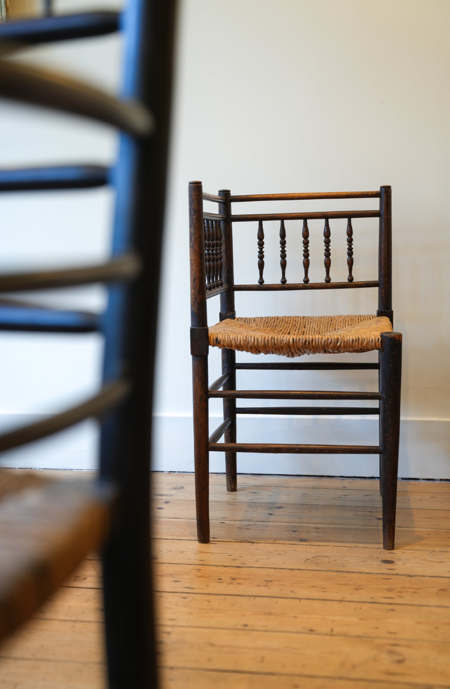 A pair of “Sussex” Corner Chairs.