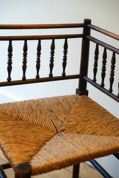 A pair of “Sussex” Corner Chairs.