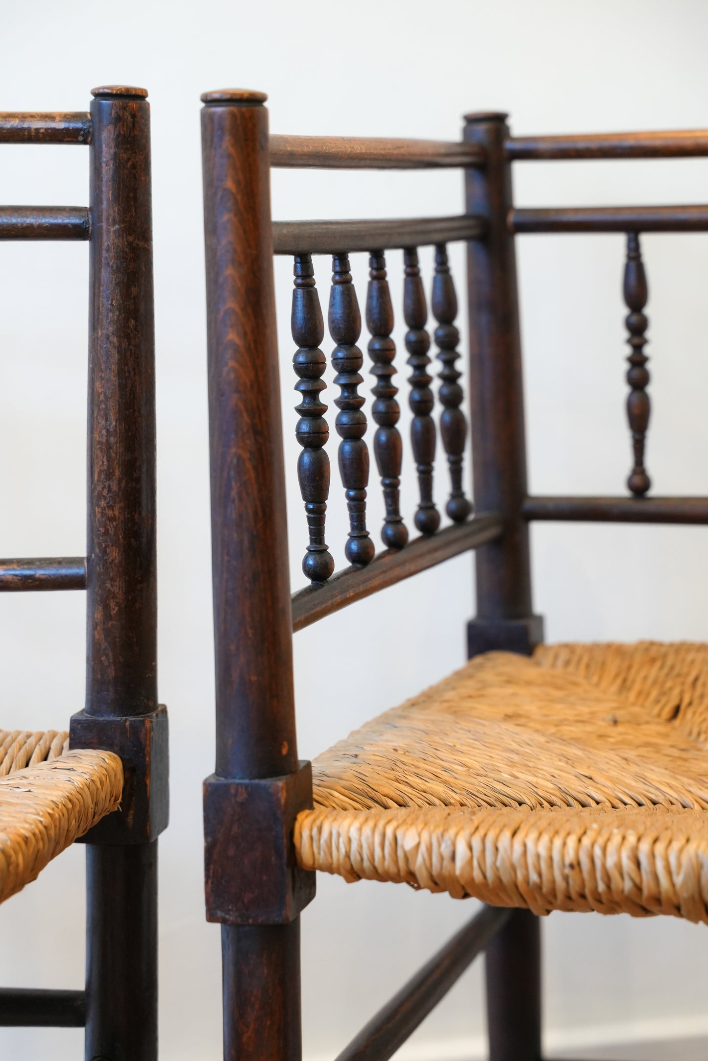 A pair of “Sussex” Corner Chairs.