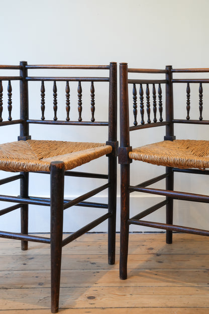 A pair of “Sussex” Corner Chairs.