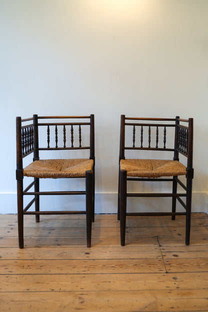A pair of “Sussex” Corner Chairs.