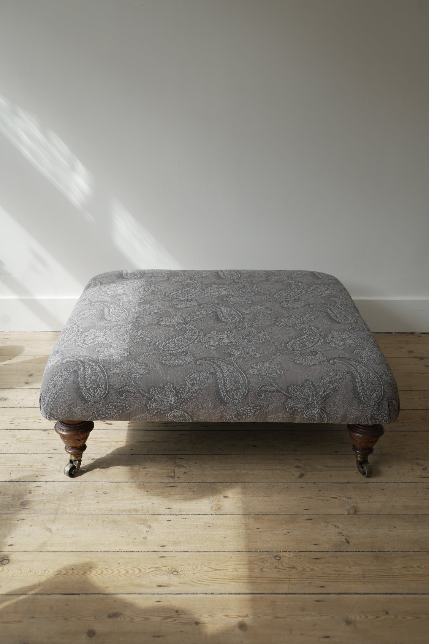 Victorian Paisley covered footstool.