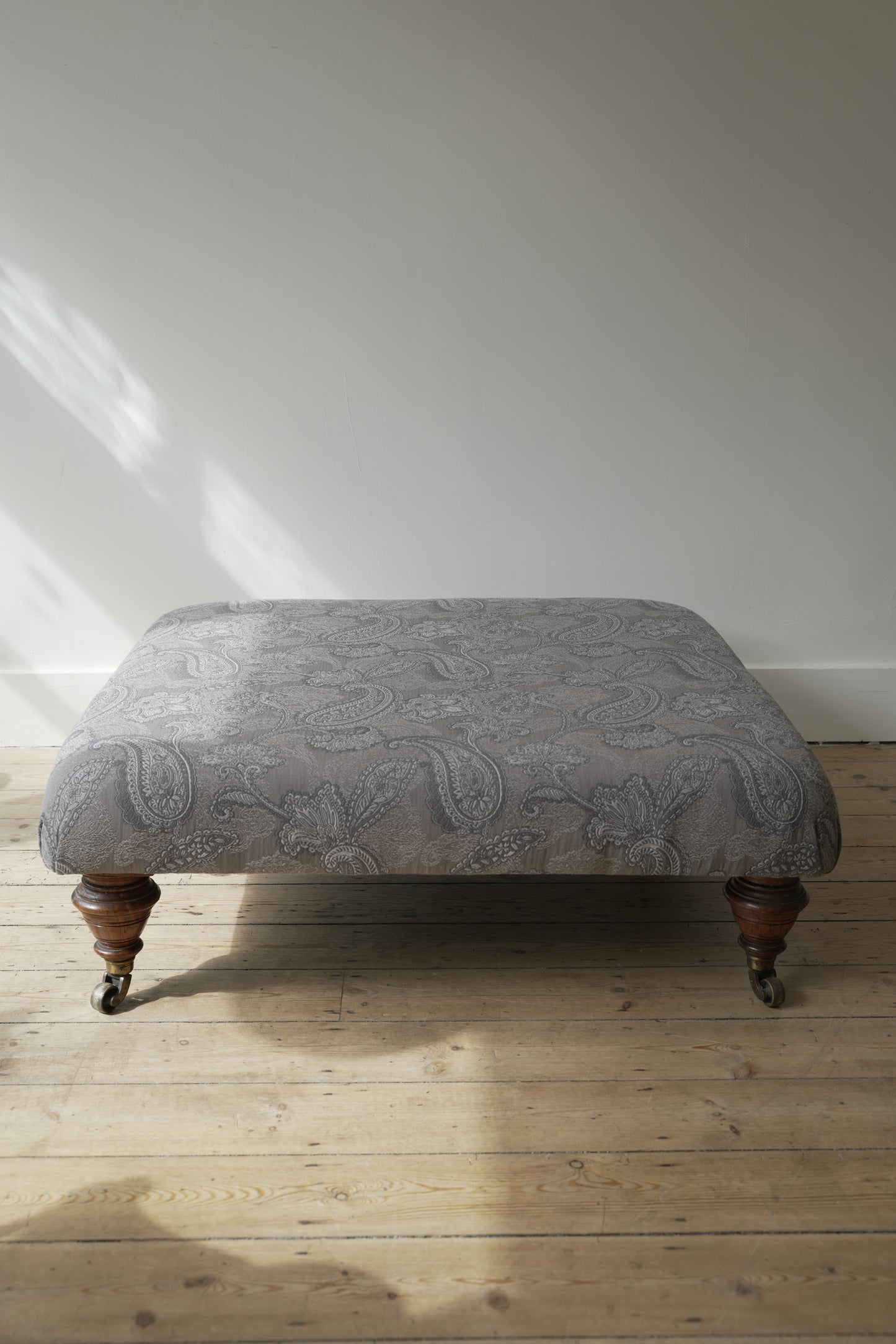 Victorian Paisley covered footstool.
